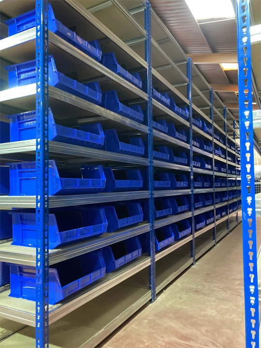 Shelves with plastic boxes
